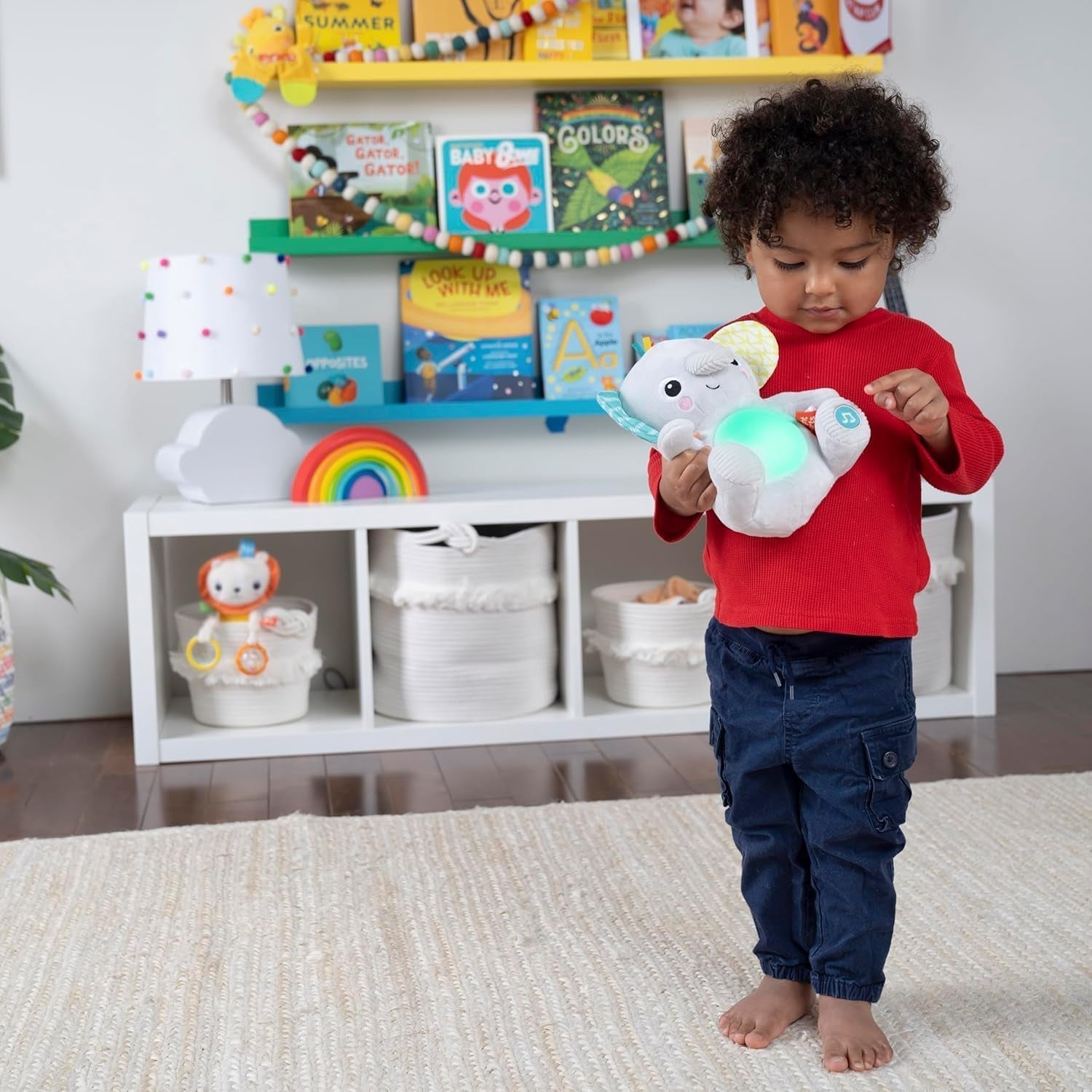 Bright Starts, jouet bébé éléphant Hug-a-bye avec lumières, chansons, différentes textures et plus encore, multicolore Jouets Bebe Naty Shop
