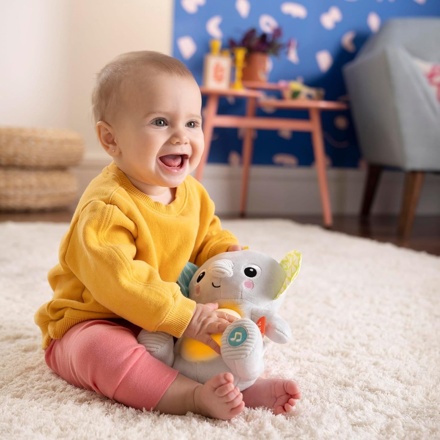 Bright Starts, jouet bébé éléphant Hug-a-bye avec lumières, chansons, différentes textures et plus encore, multicolore Jouets Bebe Naty Shop