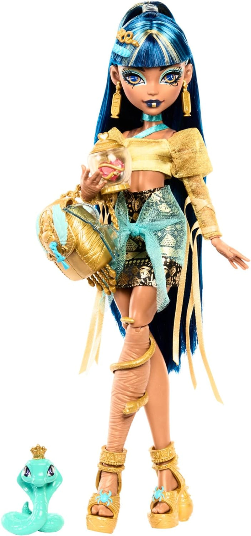 Poupée Monster High Cleo De Nile vêtue d'un chemisier doré et d'une jupe superposée, comprend le cobra Hissette et des accessoires tels qu'un cartable, une collation et un rouleau de papier toilette, HXH74