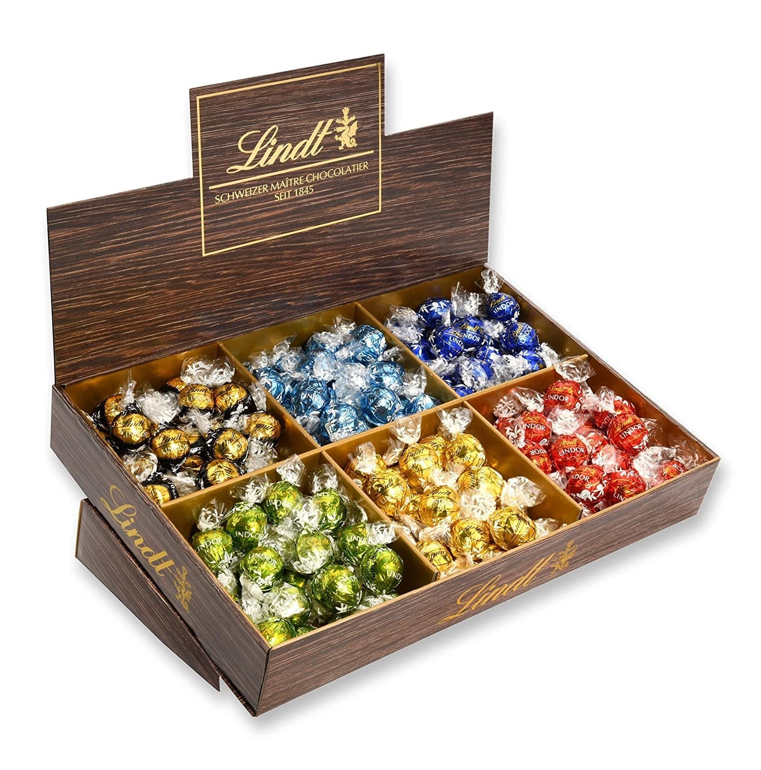 Présentation du dessus de chocolat Lindor | 1718 g and chocolate bars with marzipan | 25 barres x 50g en présentoir | 1250g | Pâte d'amande pure recouverte de chocolat noir | Barres de chocolat