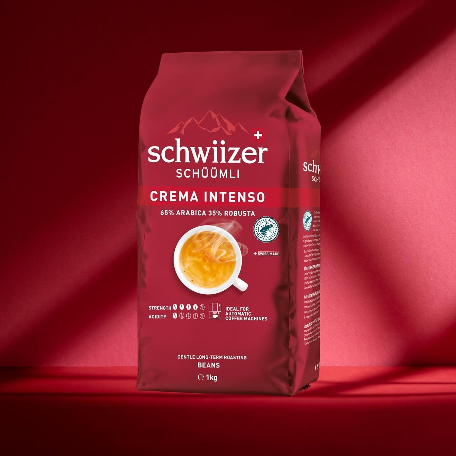 Schwiizer Schüümli Intenso, grains de café Arabica/Robusta, corsé et intense, idéal pour machines à expresso automatiques, force 4/5, torréfaction moyenne, Rainforest Alliance, 1kg