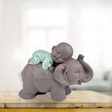 Zen'Light Statue Bouddha Bonze Dormant sur un Éléphant - Ambiance zen dans votre espace sacré - belle figure de bon augure -H 9,5 cm, Marron & Vert Statuettes et sculptures Naty Shop